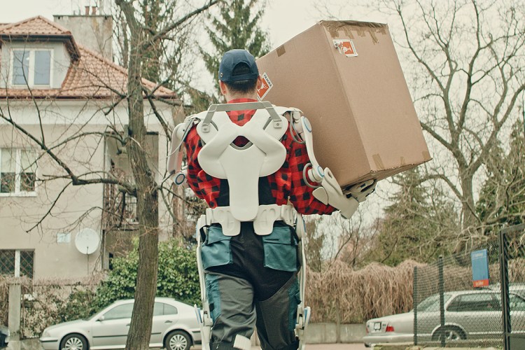 A courier wearing an exoskeleton suit carrying a package. Will these exosuits change the way we exercise in the future?