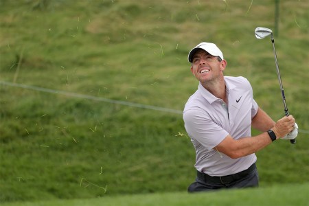 Rory McIlroy hitting a shot in a tournament. The pro golfer will soon have played 34 events in just 15 months, as of September 2021, and thus deserves much more than two weeks off from the game.
