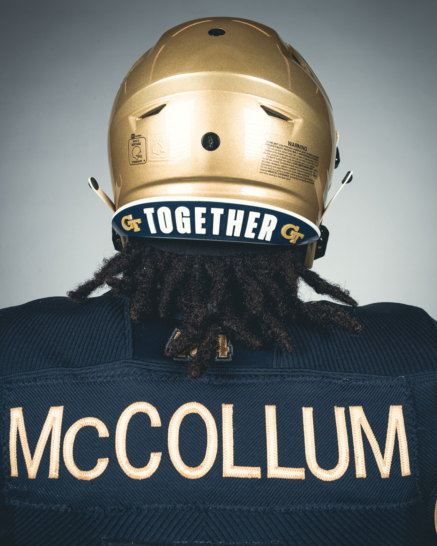 a close-up shot of the new "together" decal on the back of the georgia tech football team's helmets