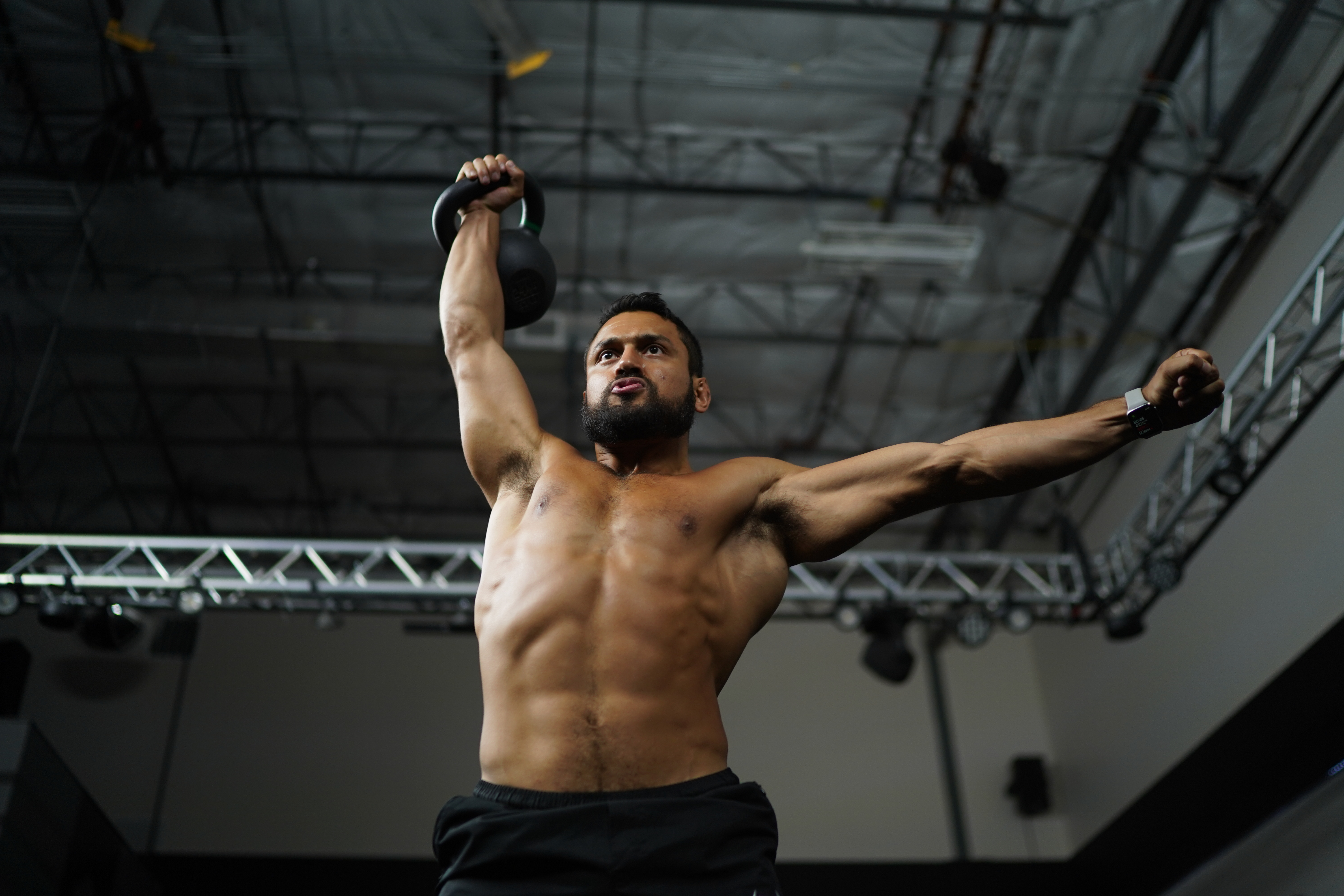Eric Leija performing a snatch, a classic kettlebell exercise