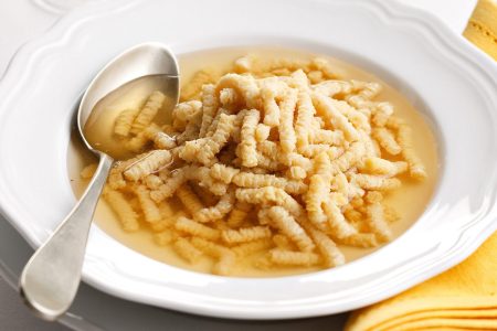 Passatelli served in broth (which is the traditional way).