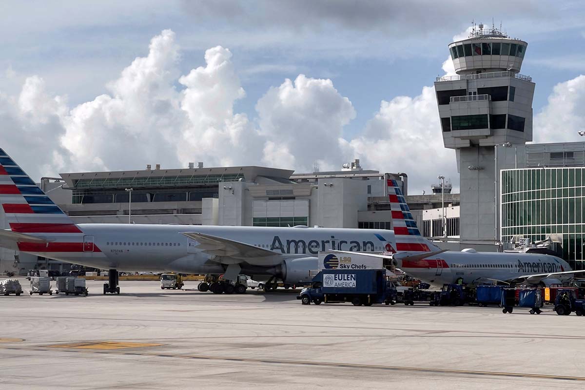 American Airlines planes are seen at the gates at Miami International Airport (MIA) on August 1, 2021 in Miami, Florida. The airline had over 3,100 delays or cancellations this week.