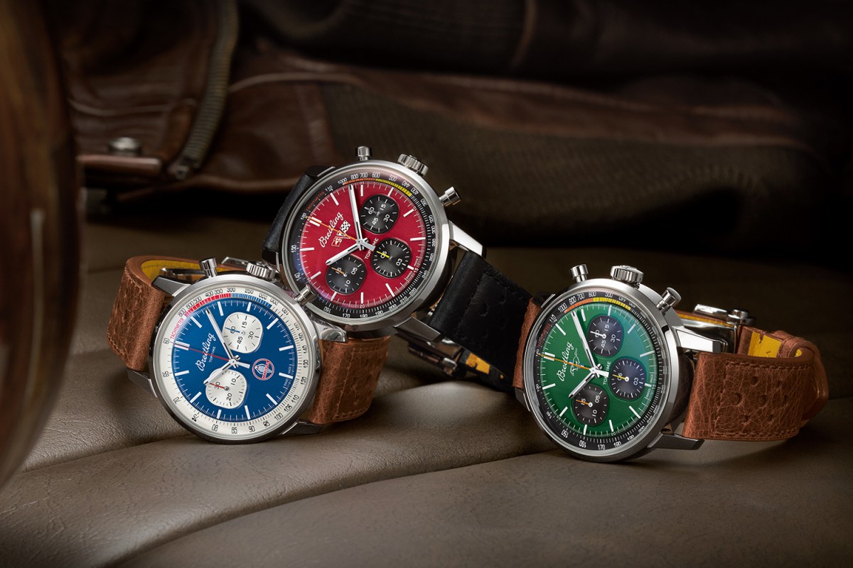 Three watches from Breitling's Top Time Classic Cars Capsule Collection sitting on the seat of a car with a leather jacket in the background