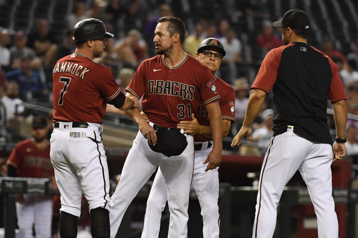 Caleb Smith reacts after having his glove confiscated. The Arizona Diamondbacks pitcher became the second MLB player ejected for sticky substances on August 18, 2021.