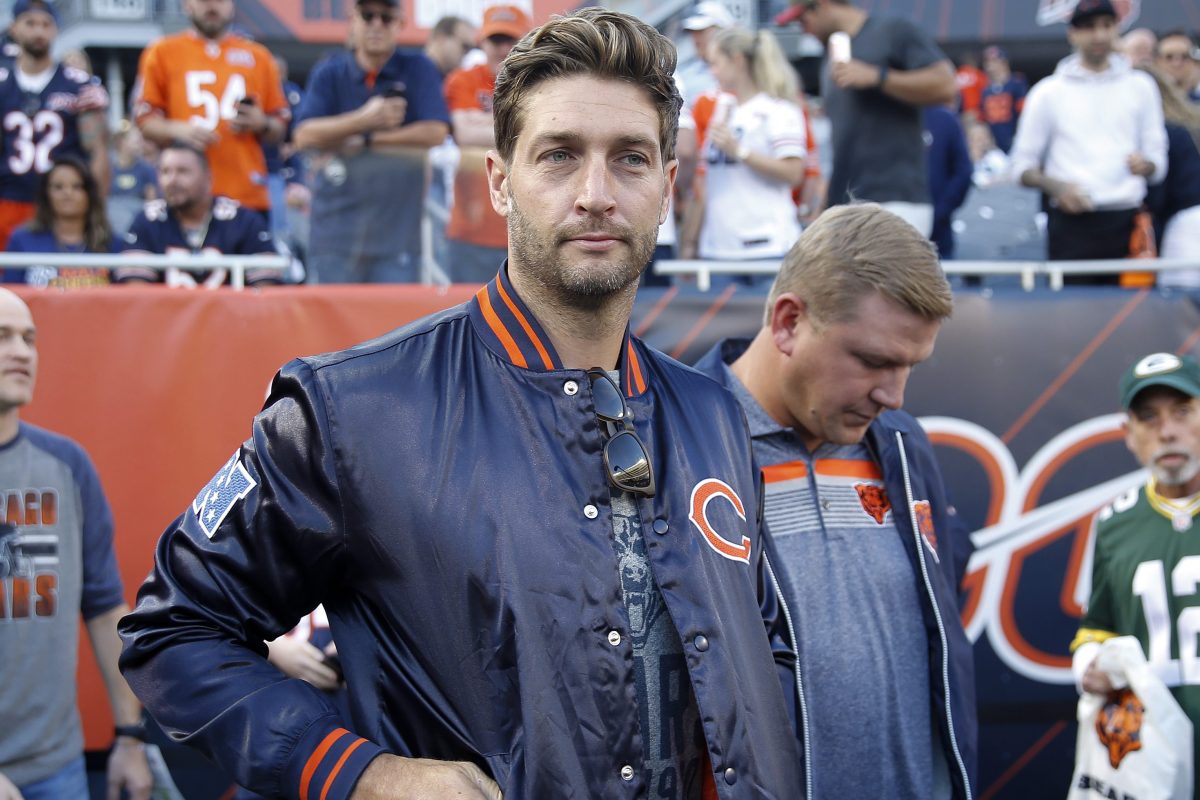 Former Chicago Bears quarterback Jay Cutler stands on the field