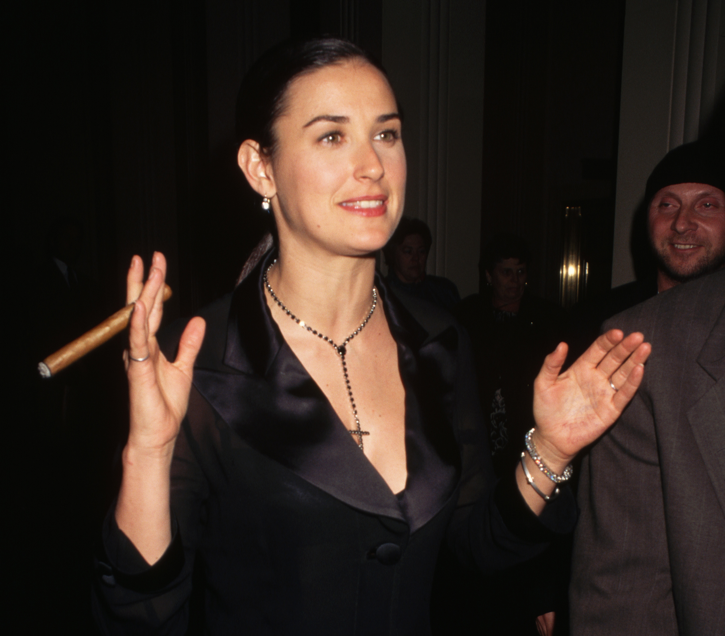 Demi Moore enjoys a cigar outside of Carnegie Hall in 1995