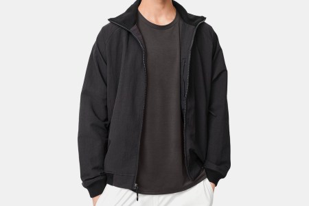 The Outdoor Voices Interstate Jacket in black. Get the men's nylon activewear layer on sale for 65% off.