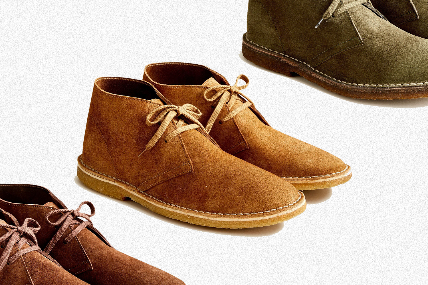 Three pairs of J.Crew MacAlister desert boots, in the colors autumn gold, hunting green and auburn. The Clarks competitors are on sale for 24% off.