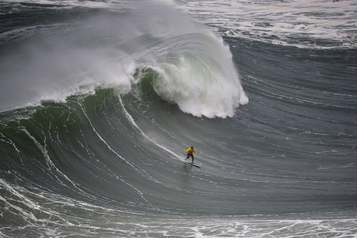 Garrett McNamara rides a wave at Praia do Norte in Nazaré in 2014