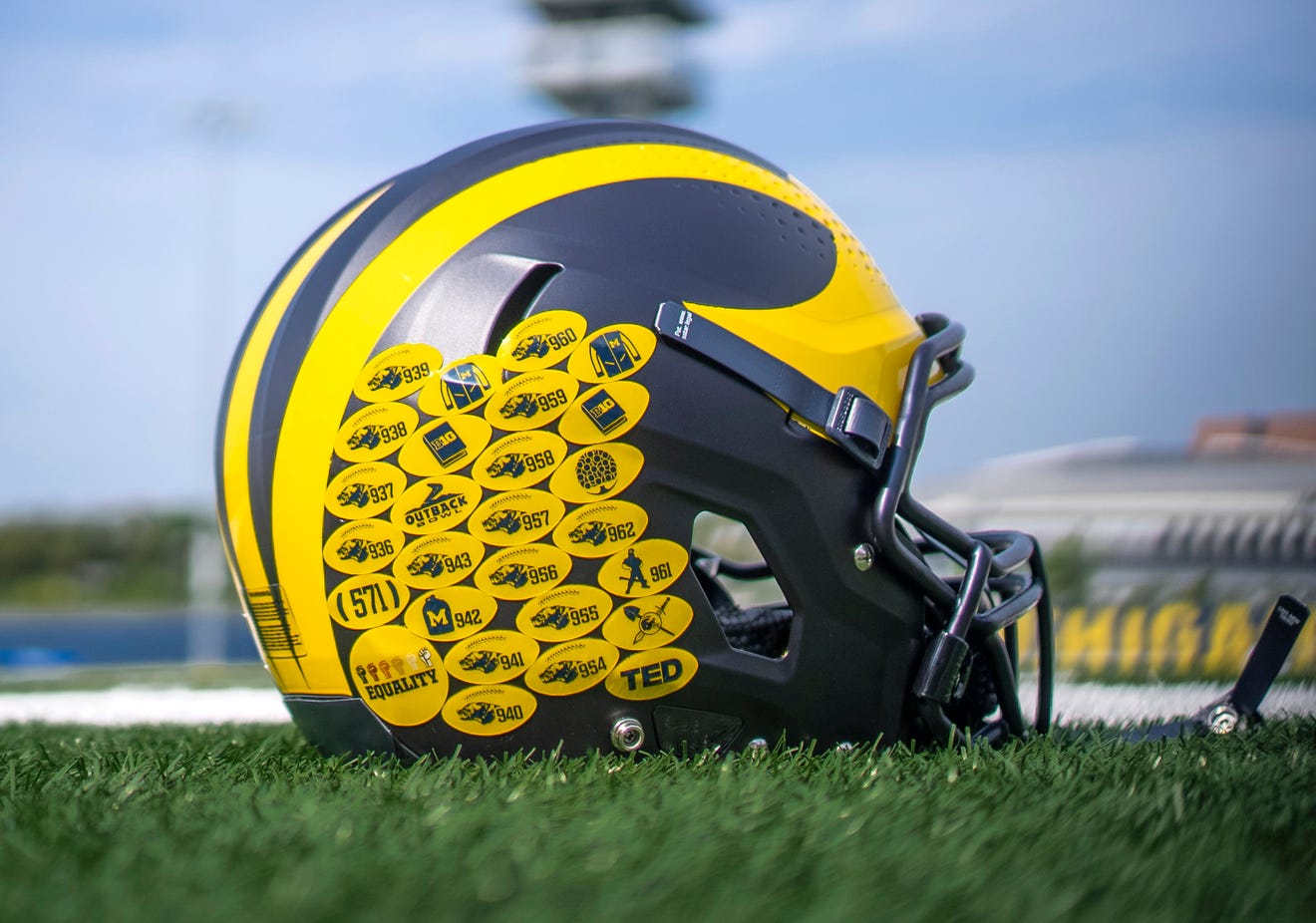 the university of michigan football team's new helmet merit decals for 2021