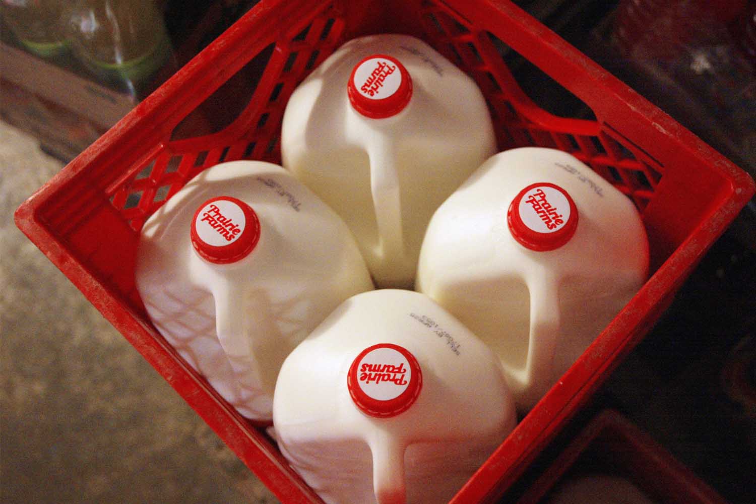 Containers of milk are seen in the cooler of a convenience store April 12, 2004 in Chicago, Illinois.