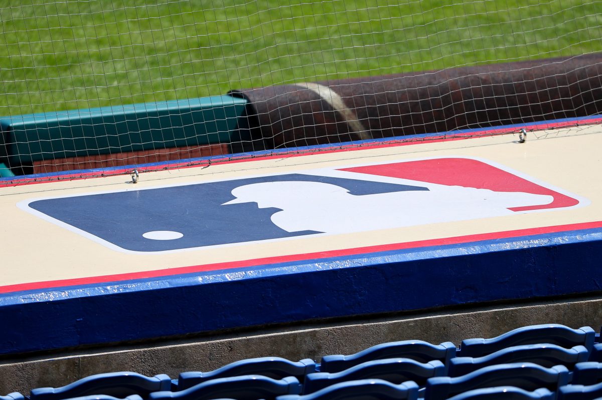 Barstool Sports and MLB are probably not working together, despite recent reports. Pictured here: The Major League Baseball logo on top of a dugout.