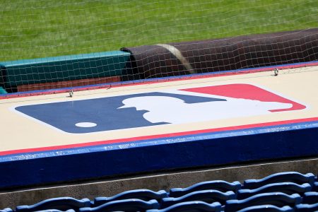 Barstool Sports and MLB are probably not working together, despite recent reports. Pictured here: The Major League Baseball logo on top of a dugout.