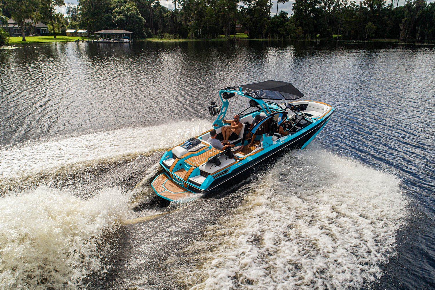 The Super Air Nautique GS22E, an electric towboat from Correct Craft, out on the water. It features technology from Watershed Innovations and Ingenity Electric.