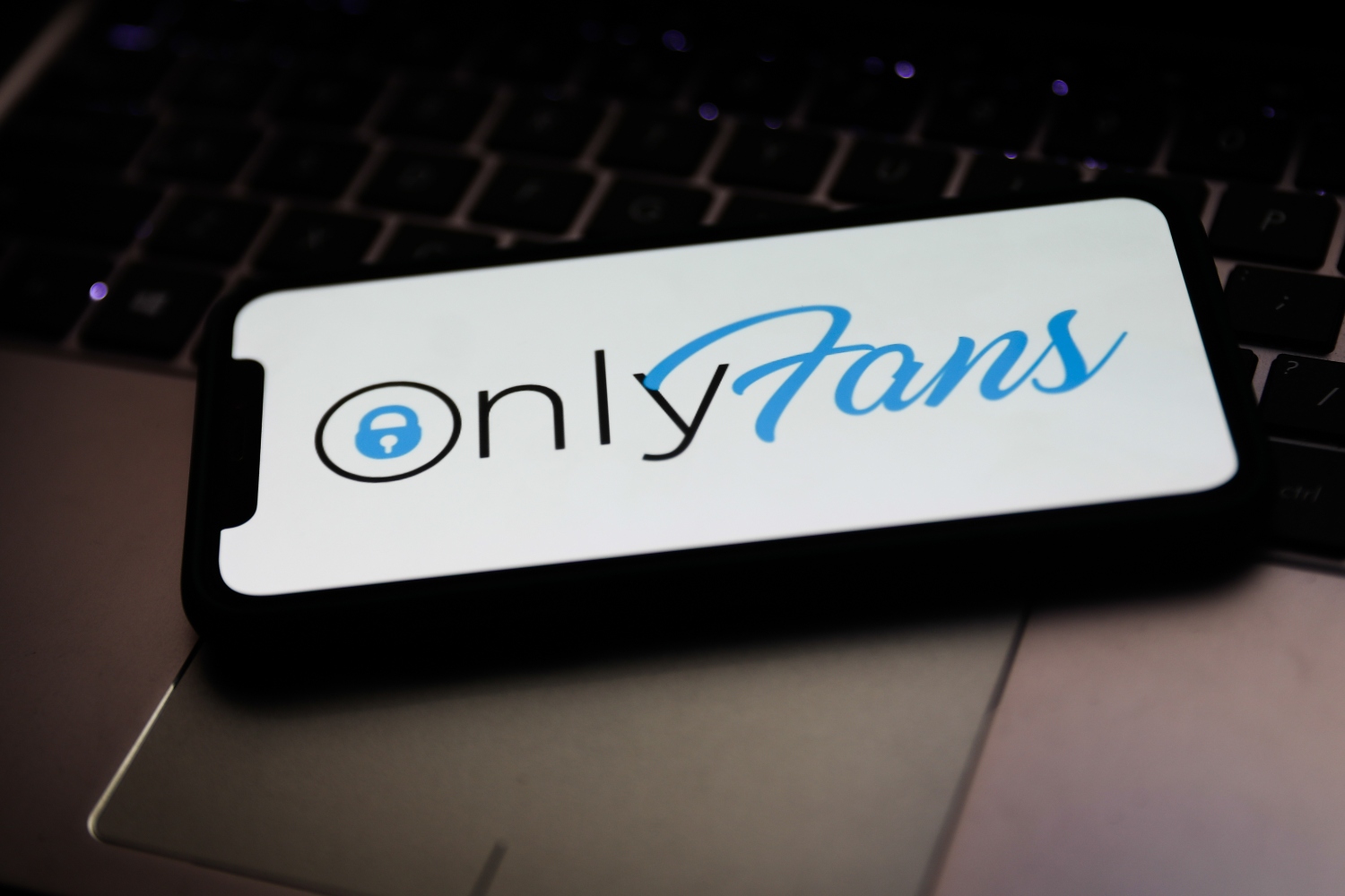 OnlyFans logo displayed on iPhone screen