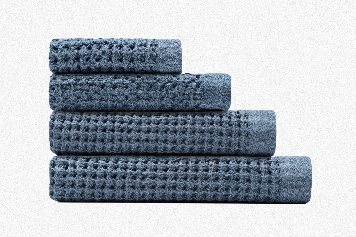 A complete set of four blue Onsen waffle weave bath towels, including a Bath Sheet, Bath Towel, Hand Towel and Face Towel