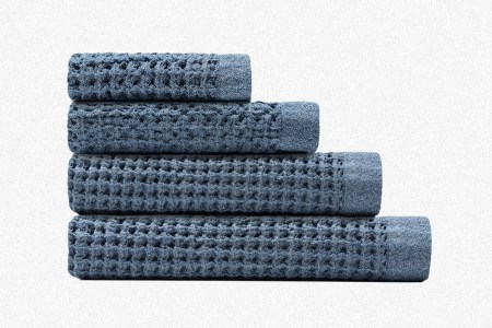 A complete set of four blue Onsen waffle weave bath towels, including a Bath Sheet, Bath Towel, Hand Towel and Face Towel
