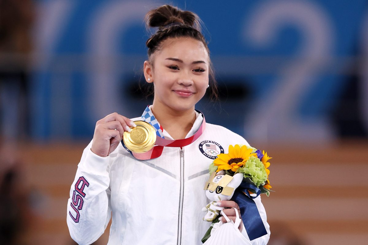Sunisa Lee of Team United States poses with her gold medal.  