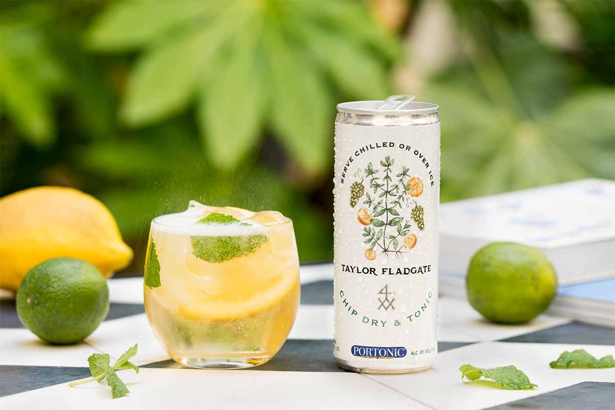 Taylor Fladgate Chip Dry & Tonic in a can, poured into a glass with mint and ice