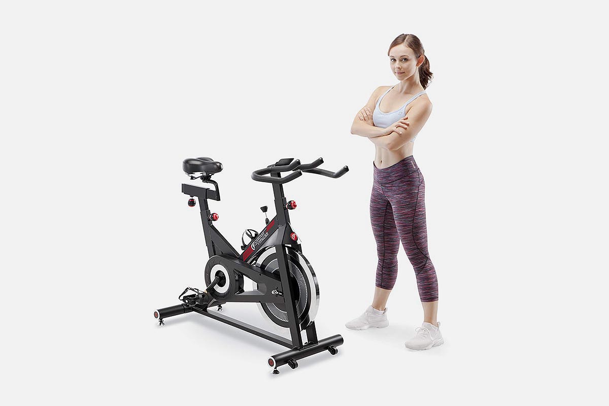 A woman and her Circuit Fitness Exercise Bike, now on sale at Woot