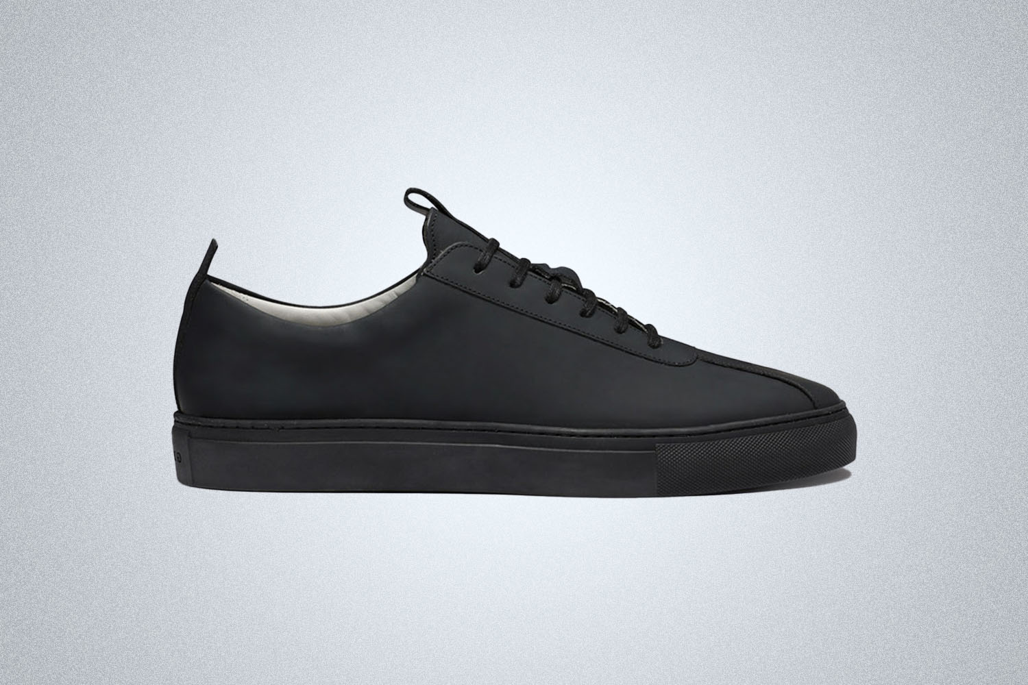 a office-ready sneaker on a grey background