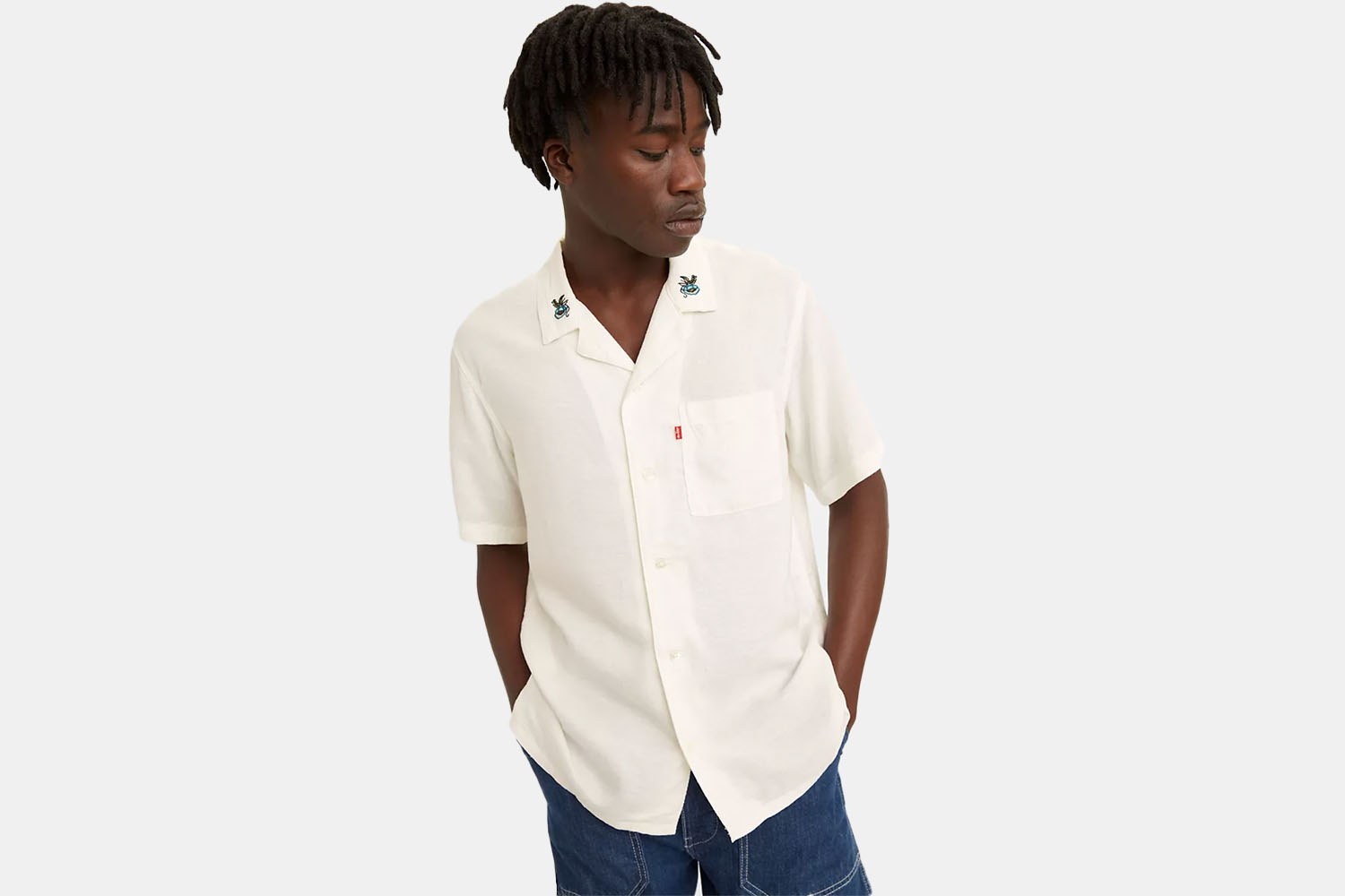 A model wearing an eggshell white Cubano Shirt from Levi's