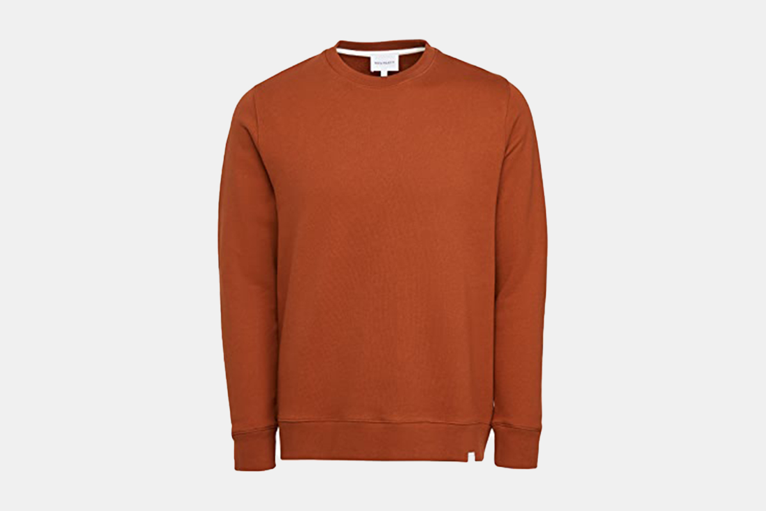 A burnt orange crewneck sweater