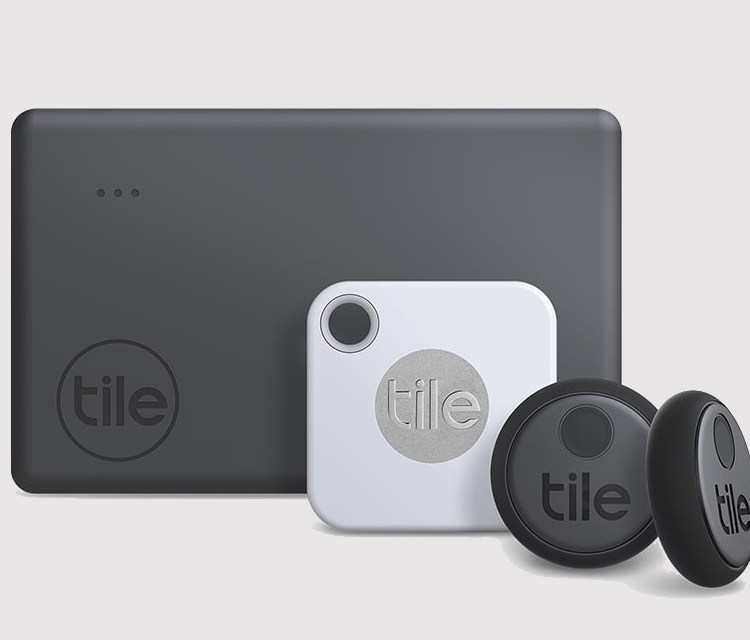 Three different sizes of Tile's Bluetooth trackers, from large rectangular ones to small circular trackers