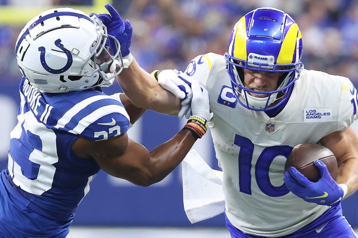Cooper Kupp throws a stiff arm against the Indianapolis Colts