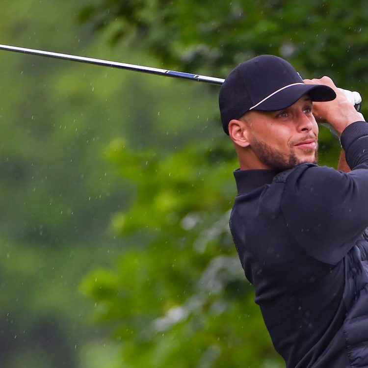 Steph Curry watches his tee shot at Muirfield Village Golf Club in Ohio