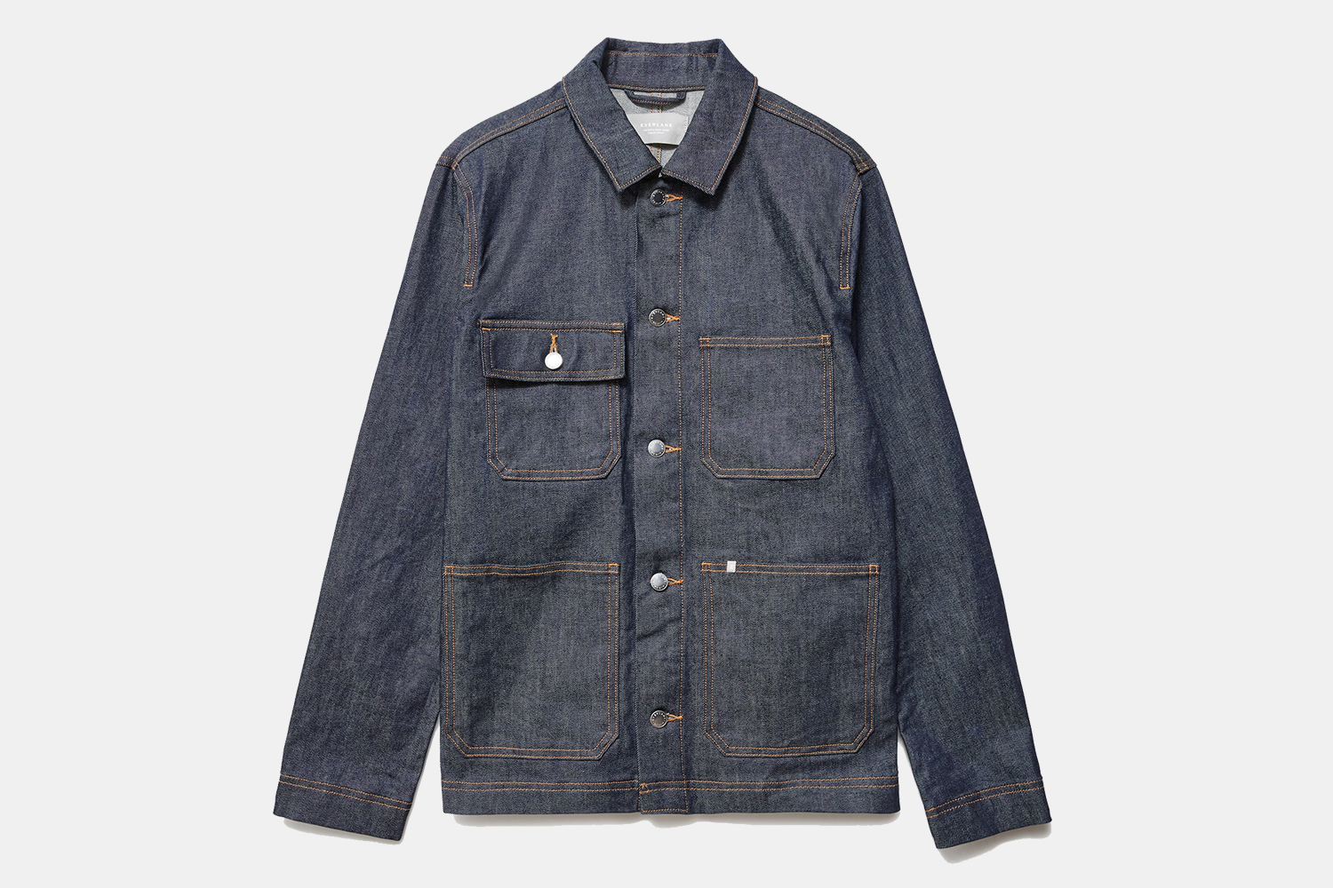 The Denim Chore Jacket from Everlane on a grey background