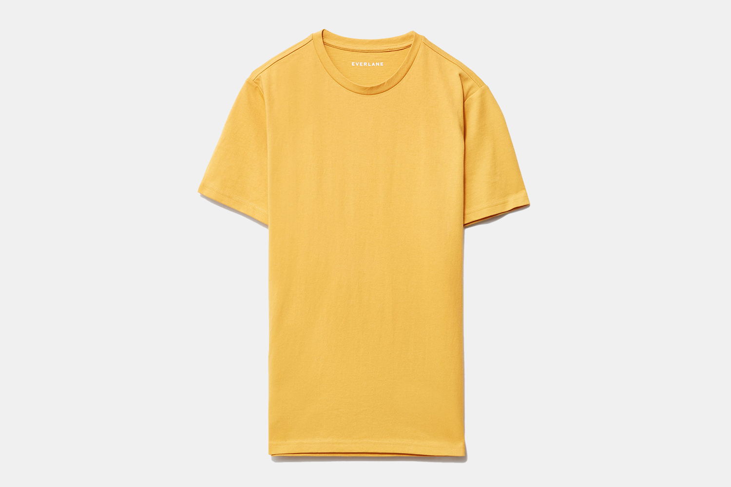 The men's Premium Weight Crew T-Shirt from Everlane in yellow on a grey background