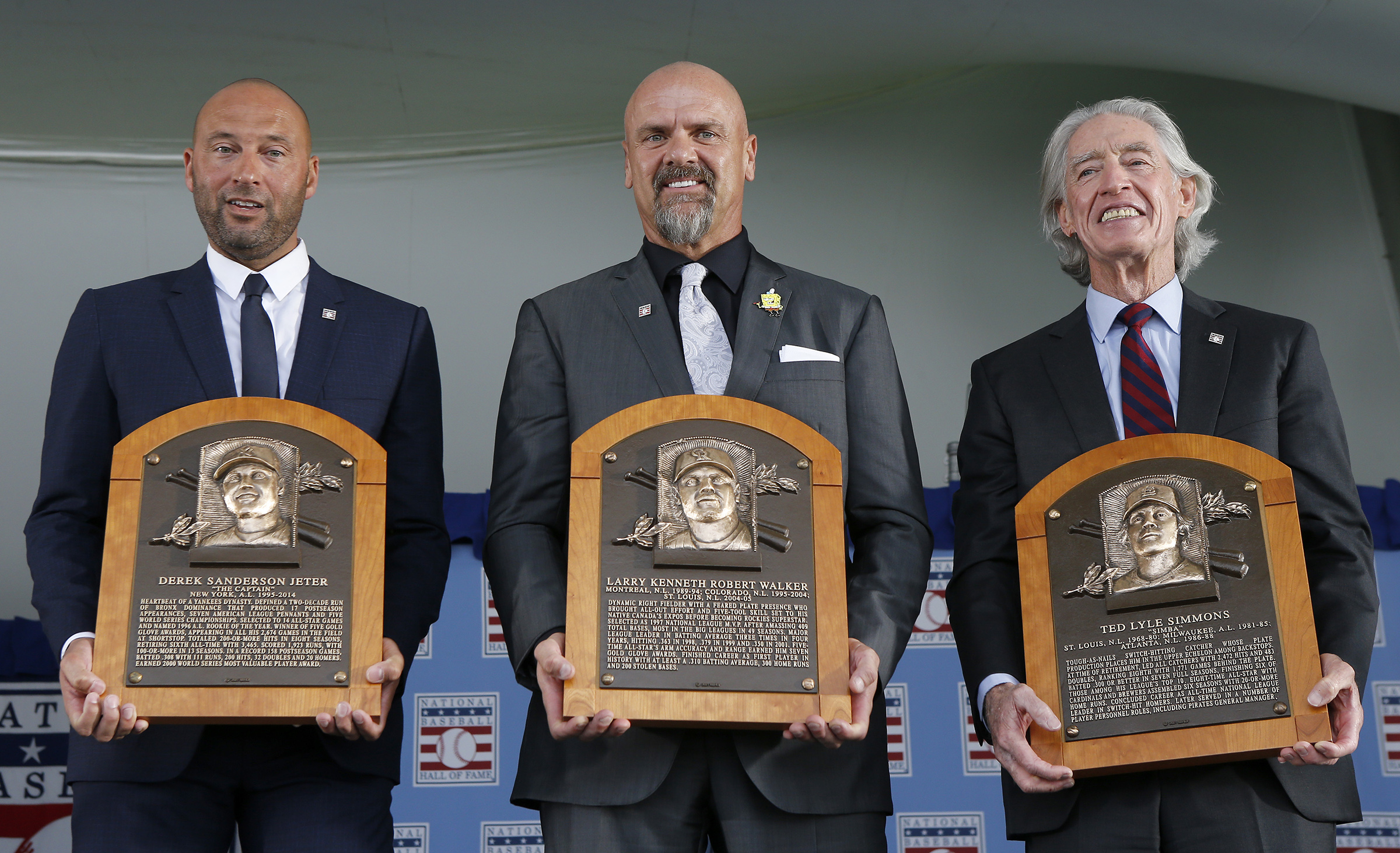 Derek Jeter, Larry Walker and Ted Simmons pose for a photograph with their plaques during the Baseball Hall of Fame induction ceremony at Clark Sports Center on September 08, 2021 in Cooperstown, New York