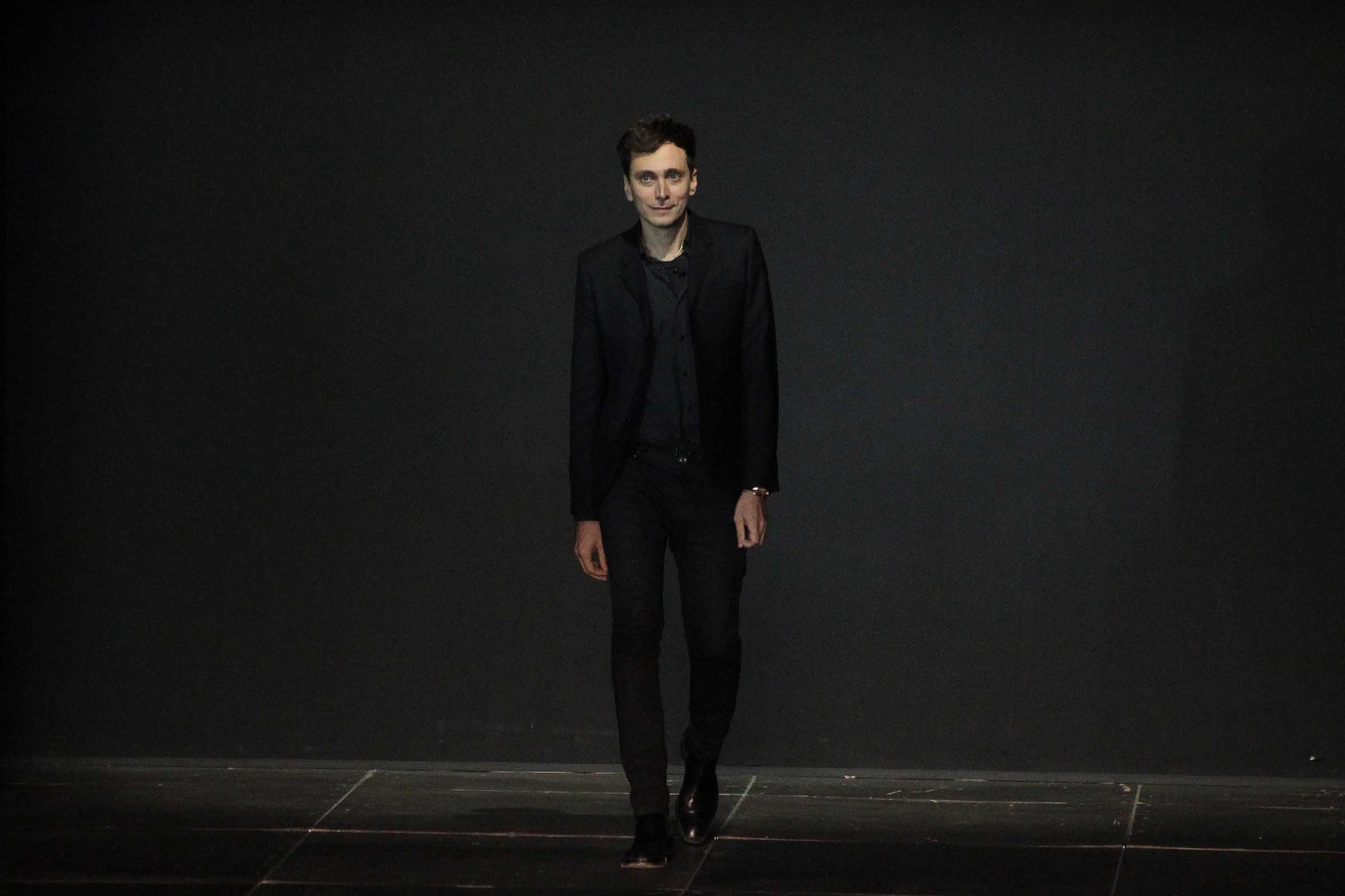 The all-world designer Hedi Slimane in his signature black suit