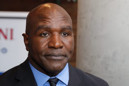 Evander Holyfield addresses the media after his statue unveiling in Atlanta.