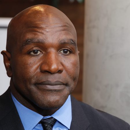 Evander Holyfield addresses the media after his statue unveiling in Atlanta.