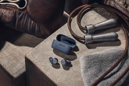 The Jabra Elite Active 75T earbuds, now on sale, next to a jump rope and other workout gear -- we rated the earbuds ideal for those with an active lifestyle.