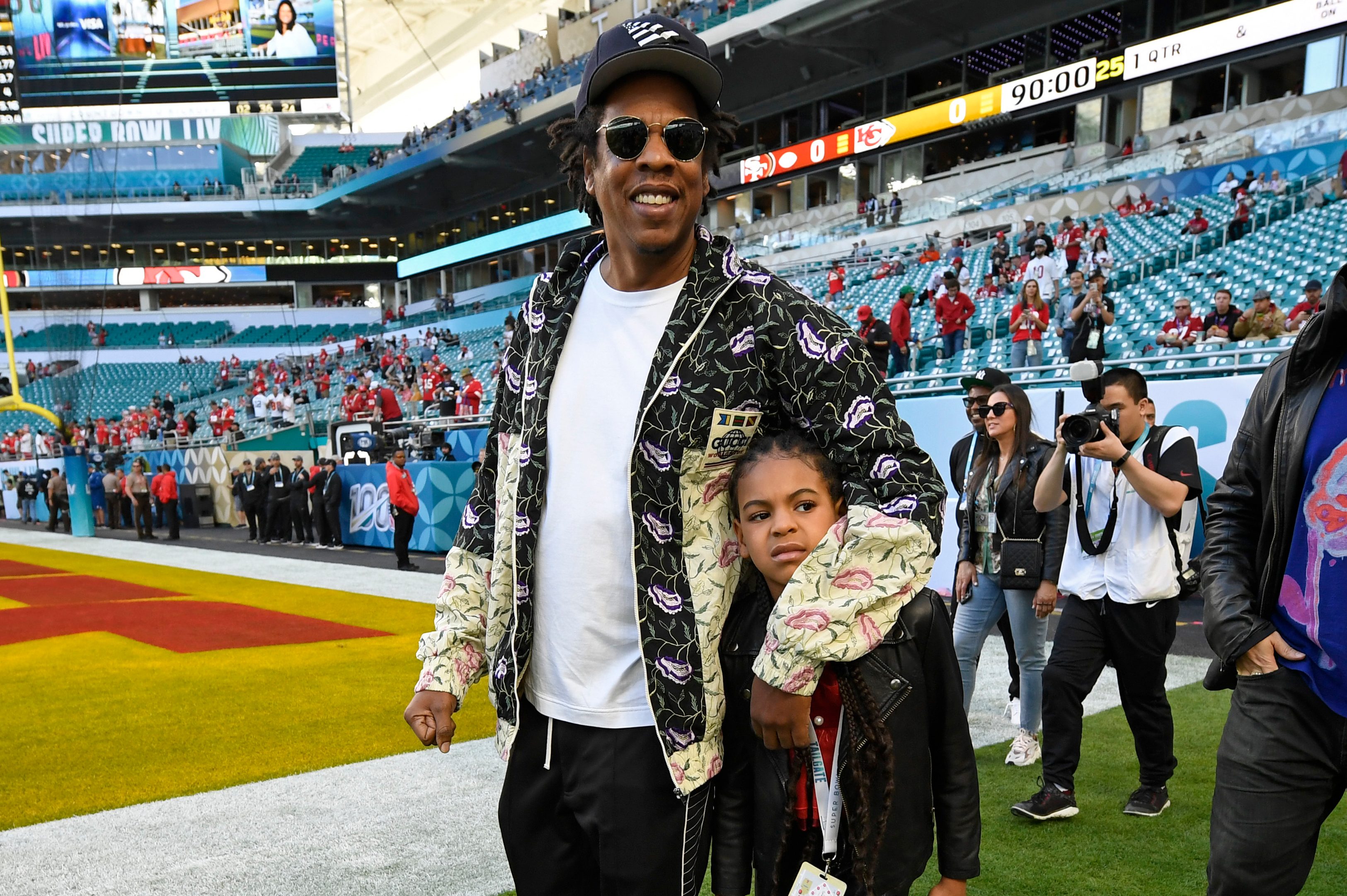 Jay-Z walks with his daughter Blue Ivy Carter before the start of Super Bowl LIV