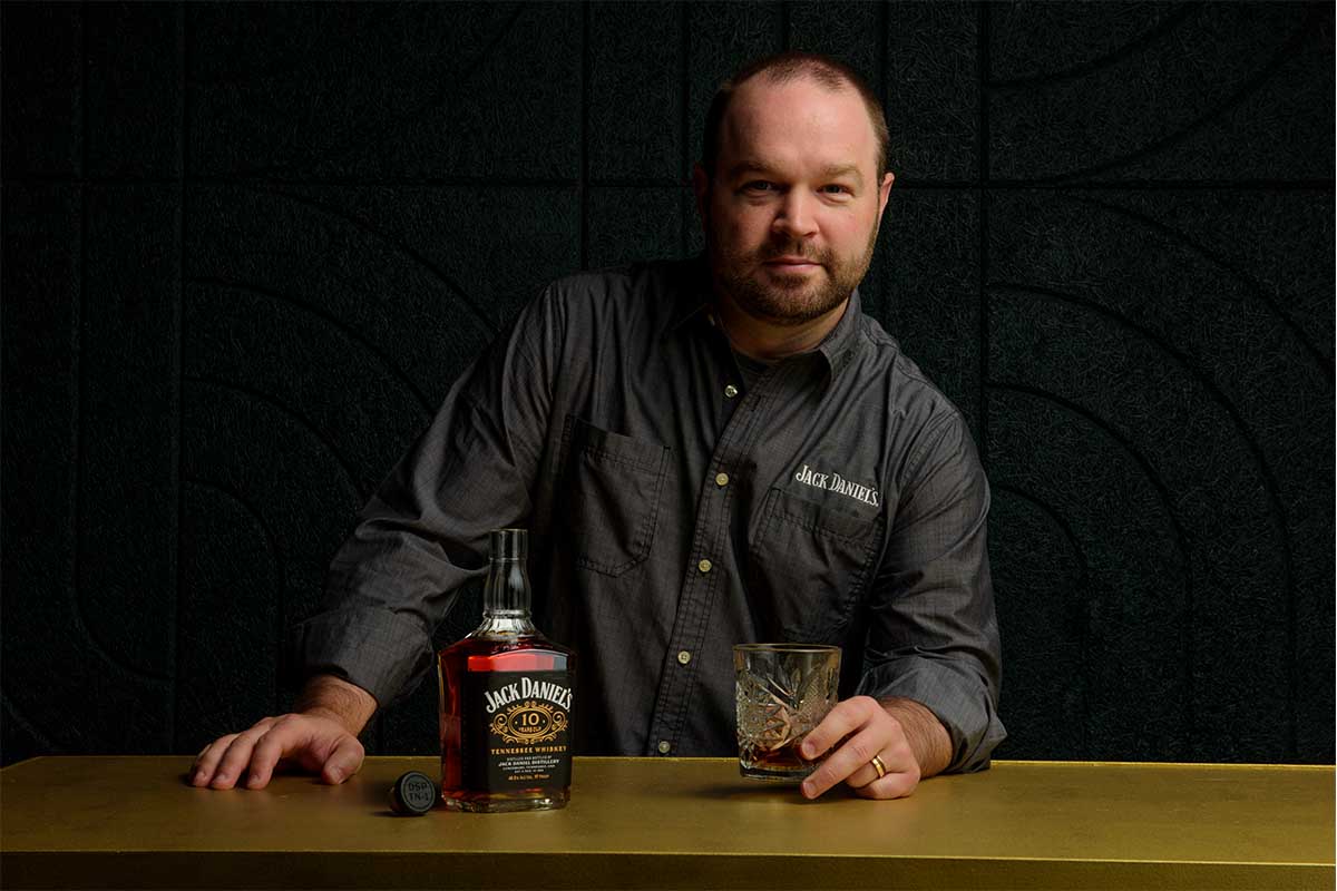 Master Distiller Chris Fletcher and a bottle of Jack Daniel's 10-Year Old Tennessee Whiskey