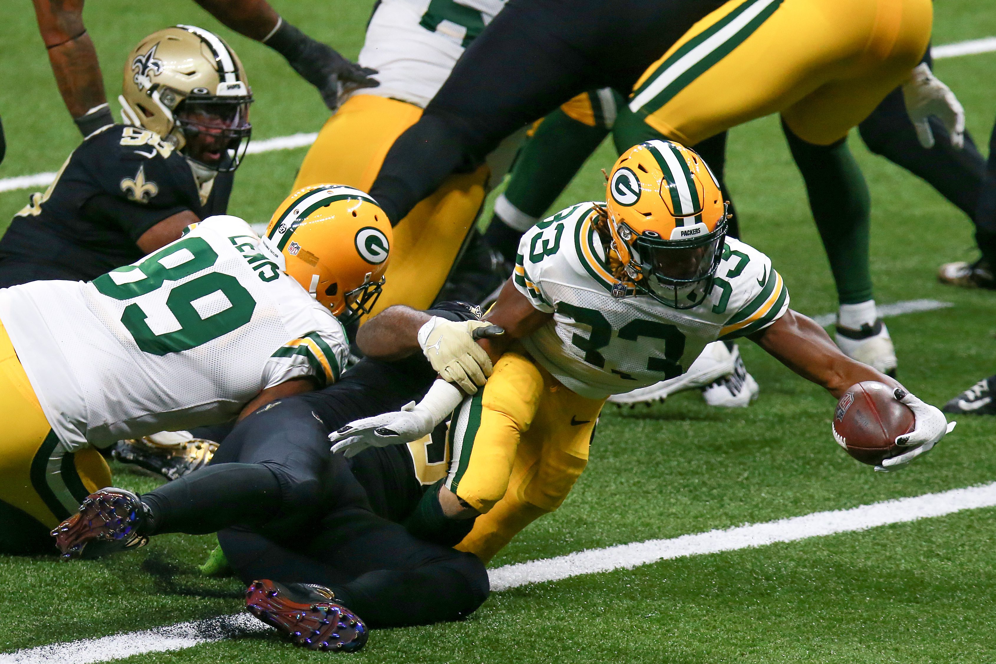 Aaron Jones of the Green Bay Packers scores a TD against the Saints