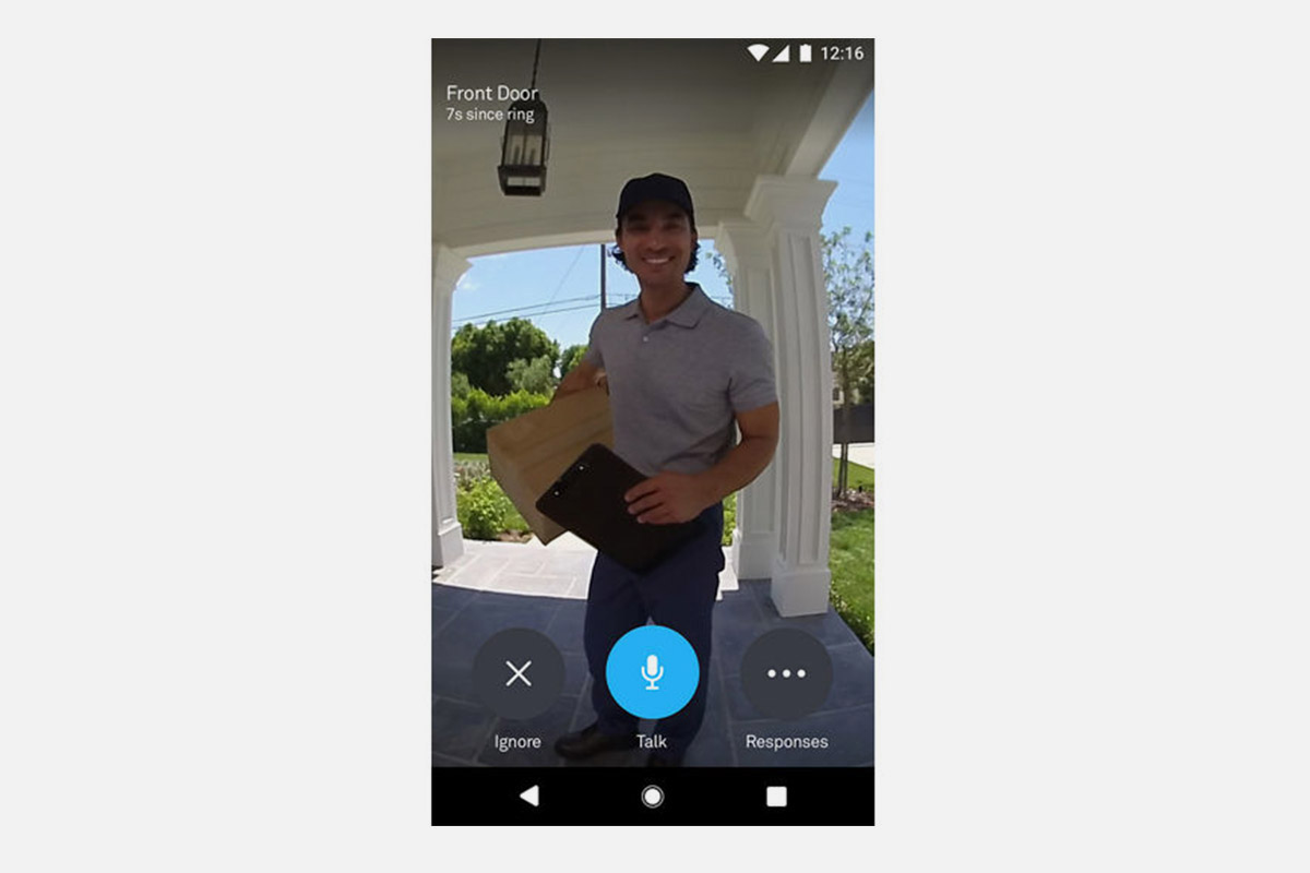 a sample video image taken from the Google Nest Hello video doorbell, showing a man delivering packages and standing on a porch