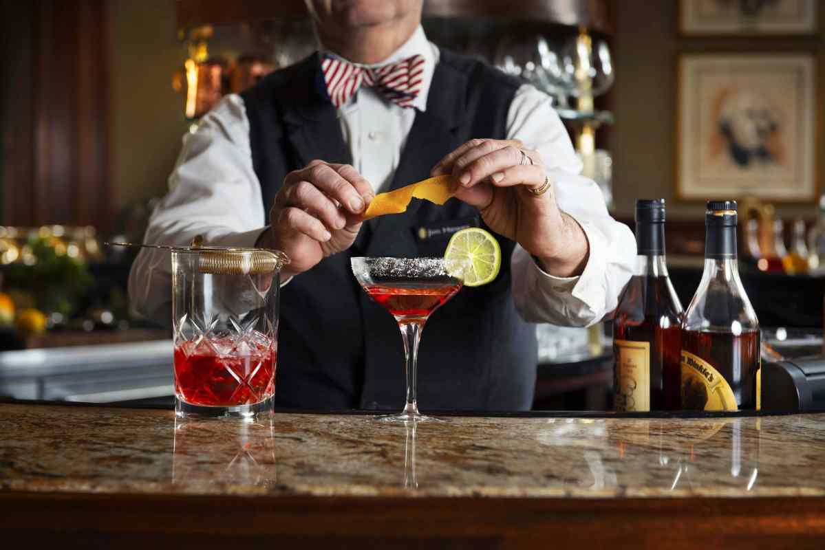 A bartender makes a cocktail at The Round Robin Bar at the Willard Intercontinental