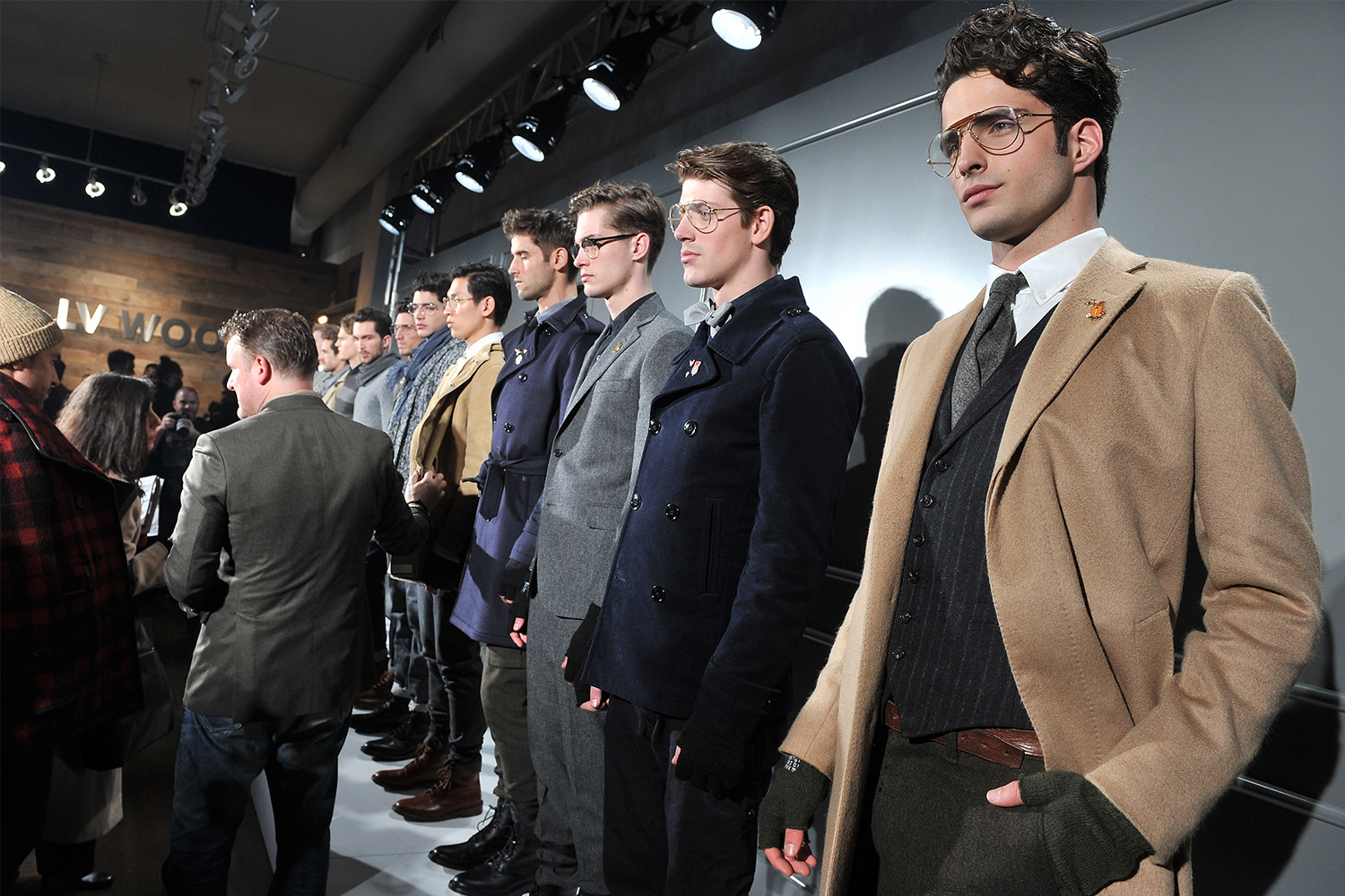A line of models wearing clothes designed by menswear designer Todd Snyder in his fall 2012 New York Fashion Week show at LV Wood