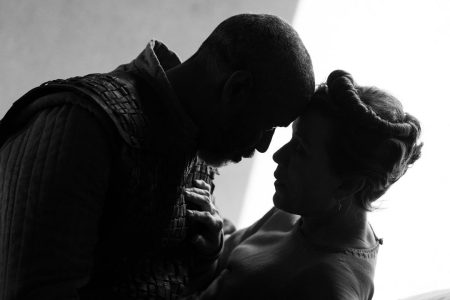 Denzel Washington and Frances McDormand touching heads in a scene from "The Tragedy of Macbeth," a black-and-white take on the Shakespearean tale from Joel Coen