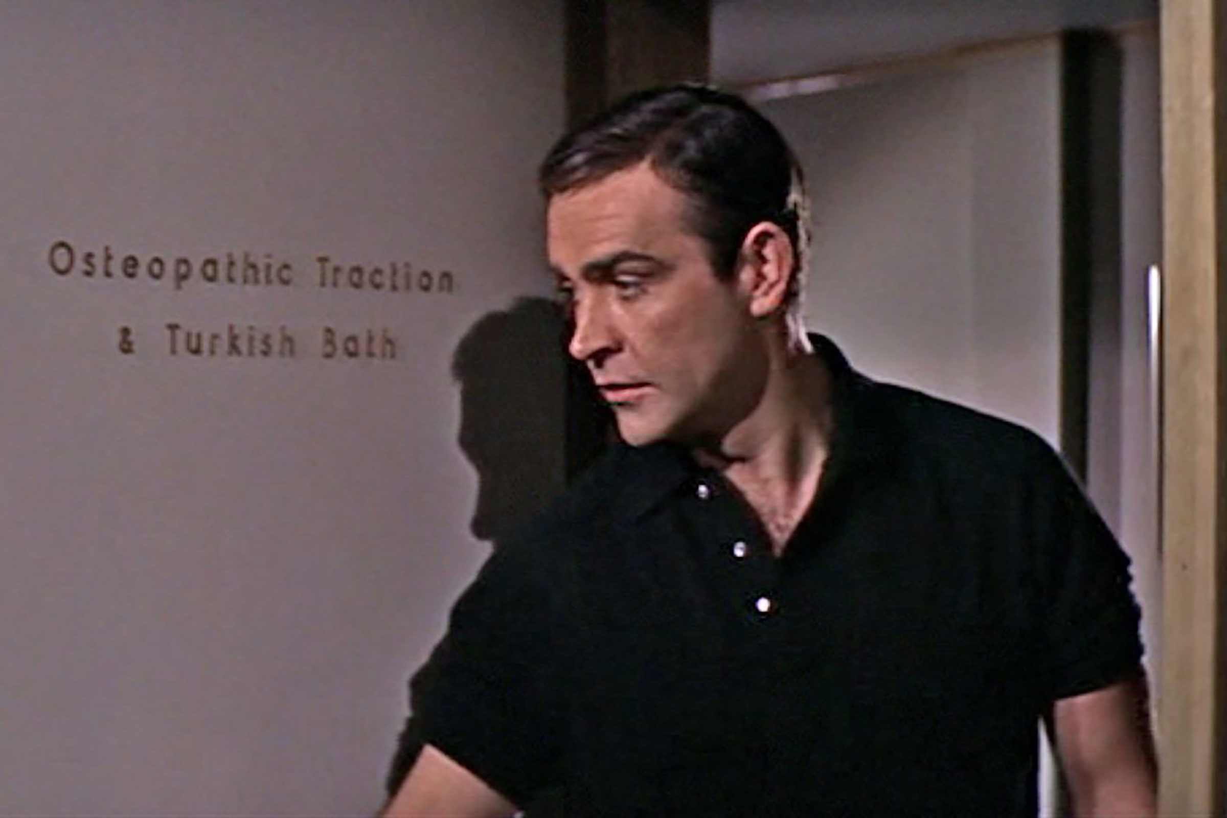 In Thunderball, Connery wears a long sleeve polo with the sleeves rolled up.