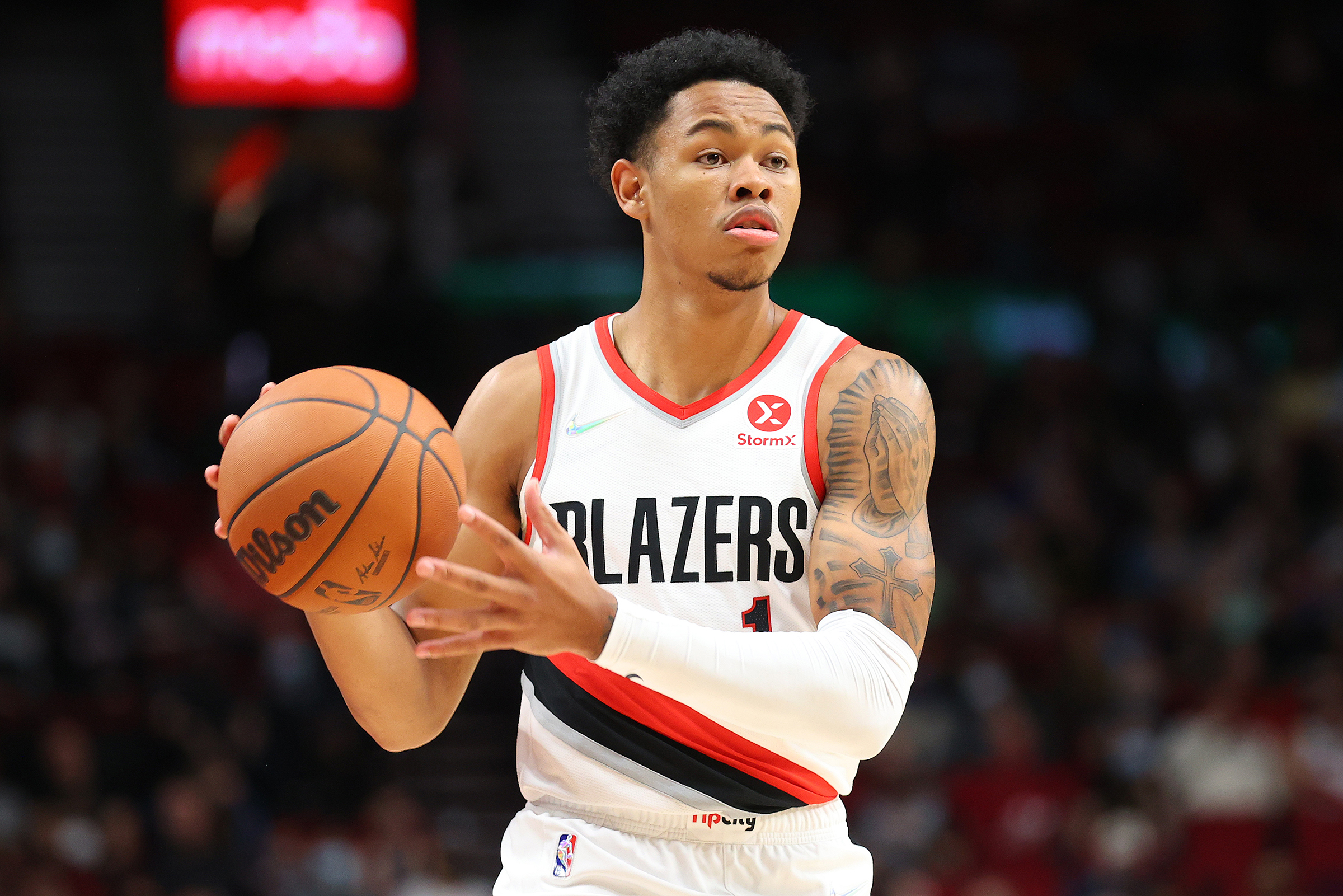 Anfernee Simons #1 of the Portland Trail Blazers handles the ball against the Golden State Warriors in the first quarter during the preseason game at Moda Center on October 04, 2021 in Portland, Oregon