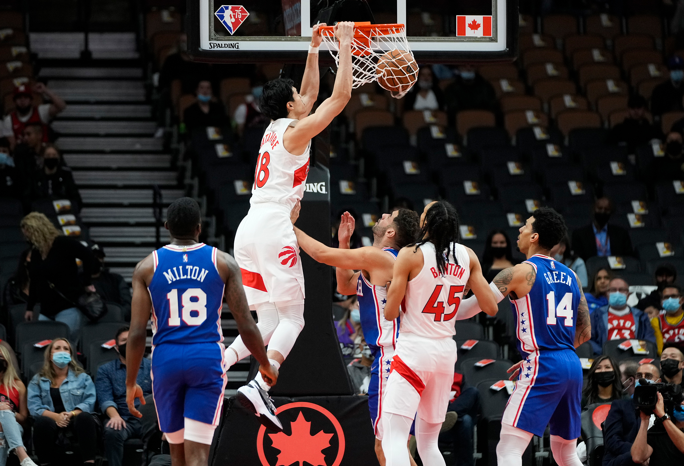 Yuta Watanabe #18 of the Toronto Raptors goes up for a slam dunk against the Philadelphia 76ers during preseason action at Scotiabank Arena on October 4, 2021 in Toronto, Canada