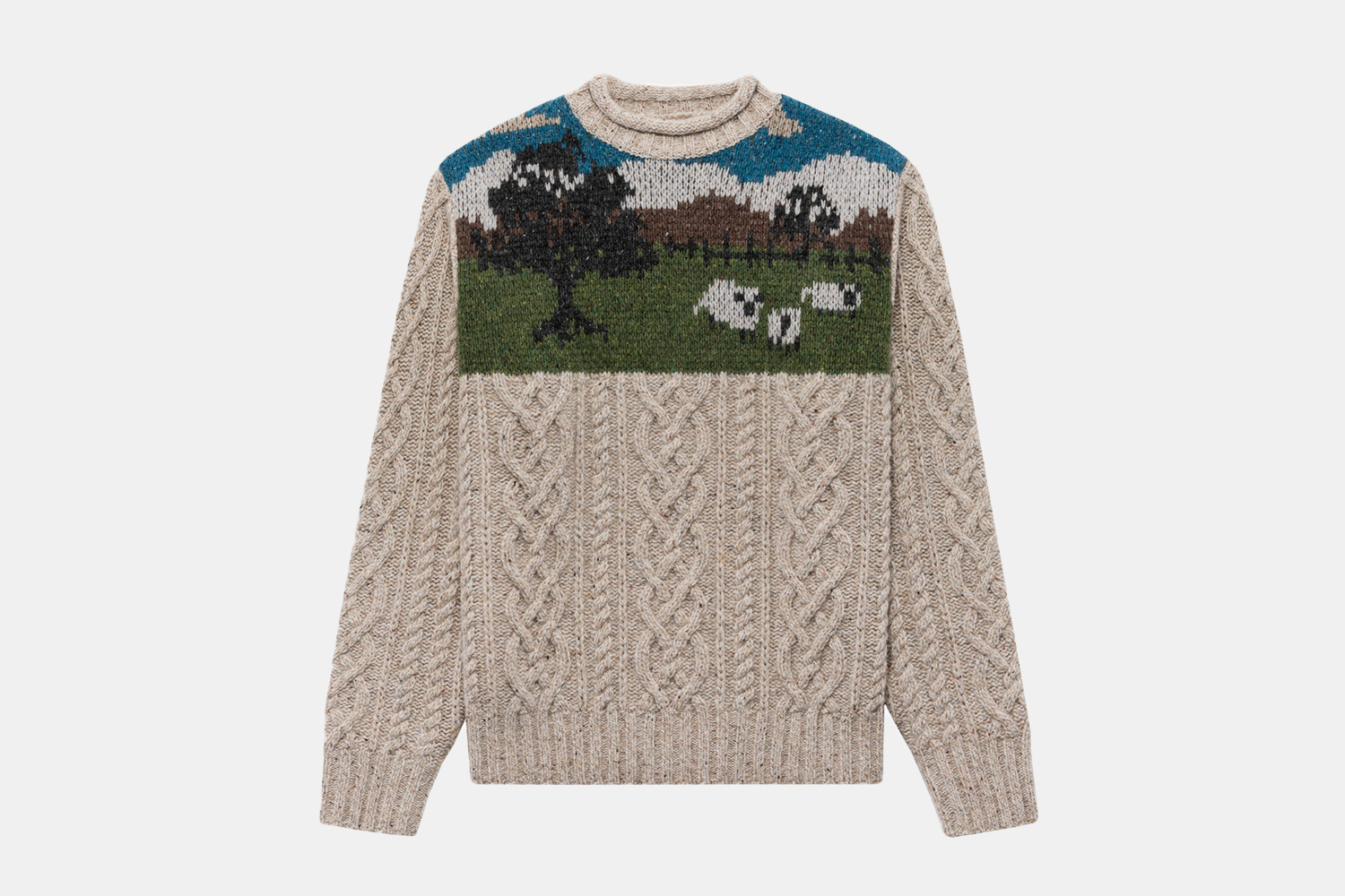 a knit sweater wit h a sheep graphic