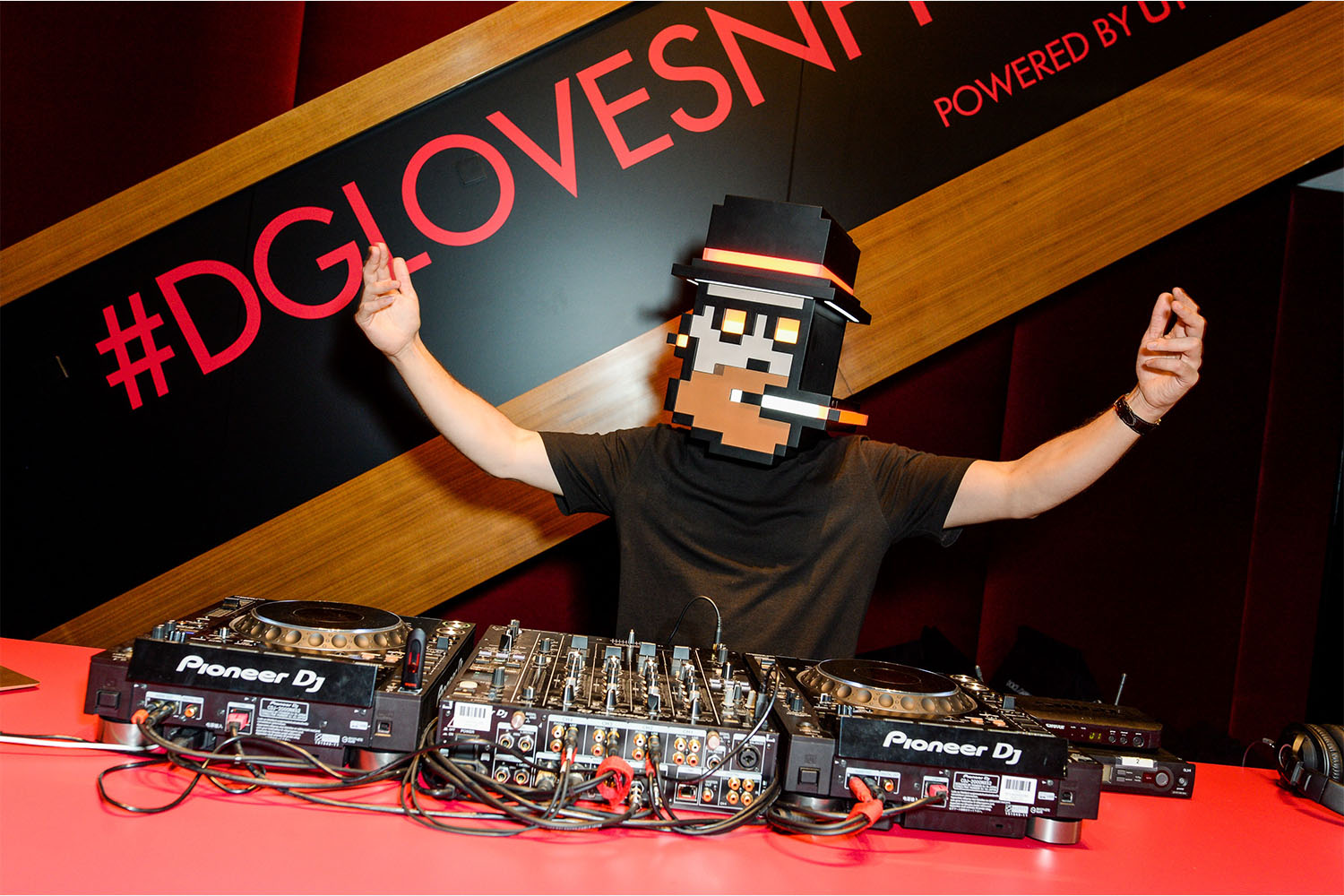 a man with a mask performing a Dj set