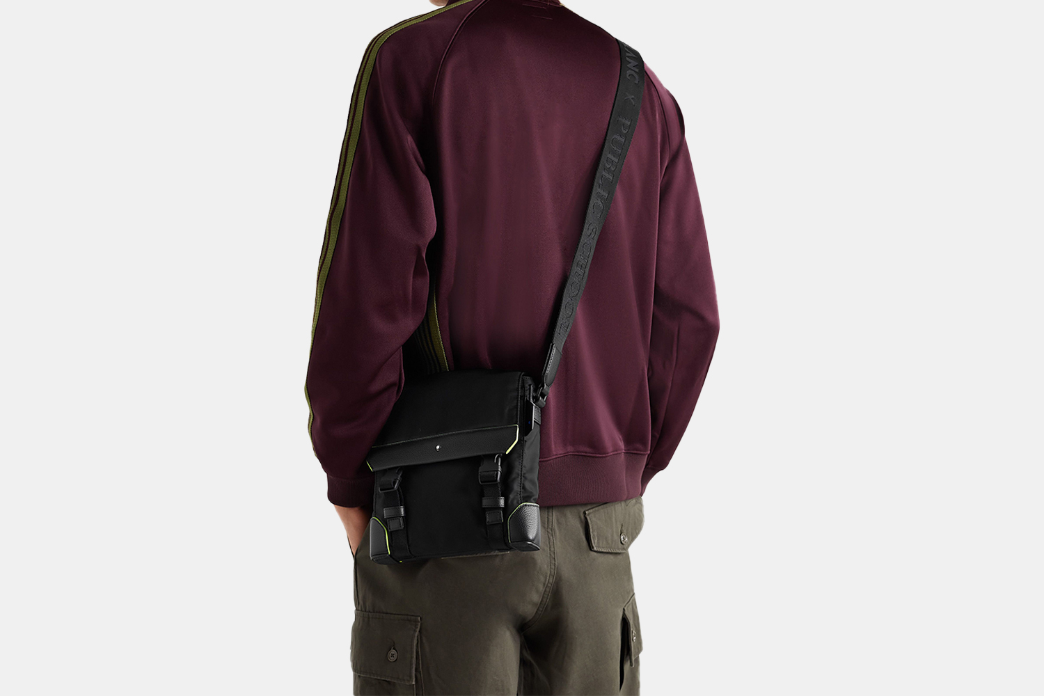 a model wearing a black bag